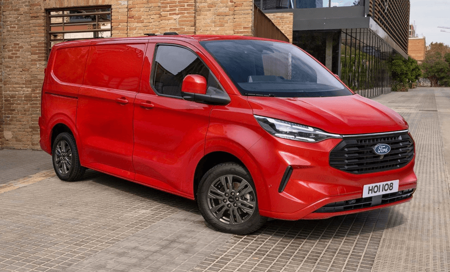 A Red Ford Transit Custom parks sideways in a residential area