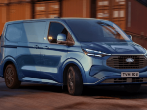 All-New Ford Transit Custom PEHV In Blue Driving Around a Corner